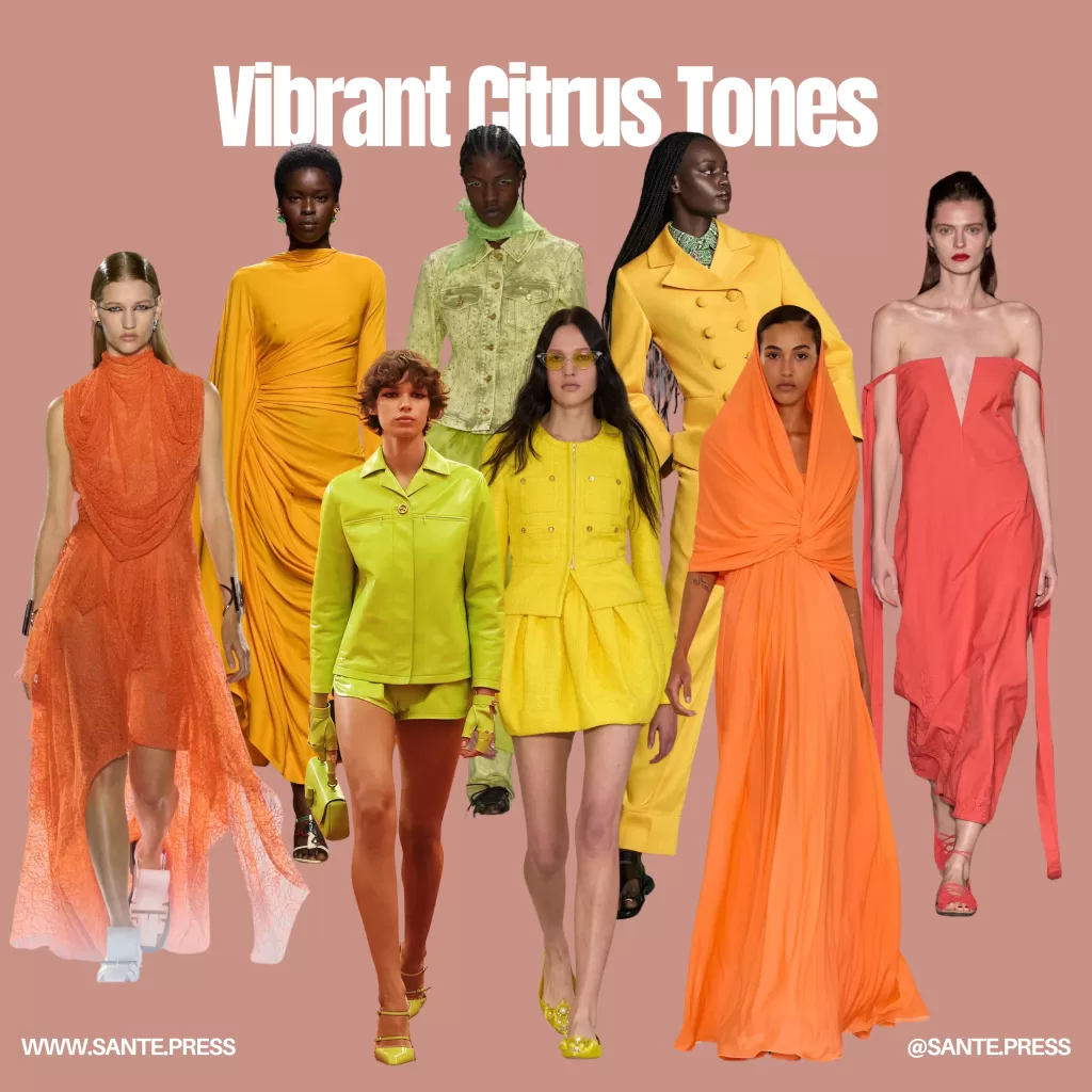 Models showcase vibrant orange dresses, exuding elegance and style in a lively fashion display