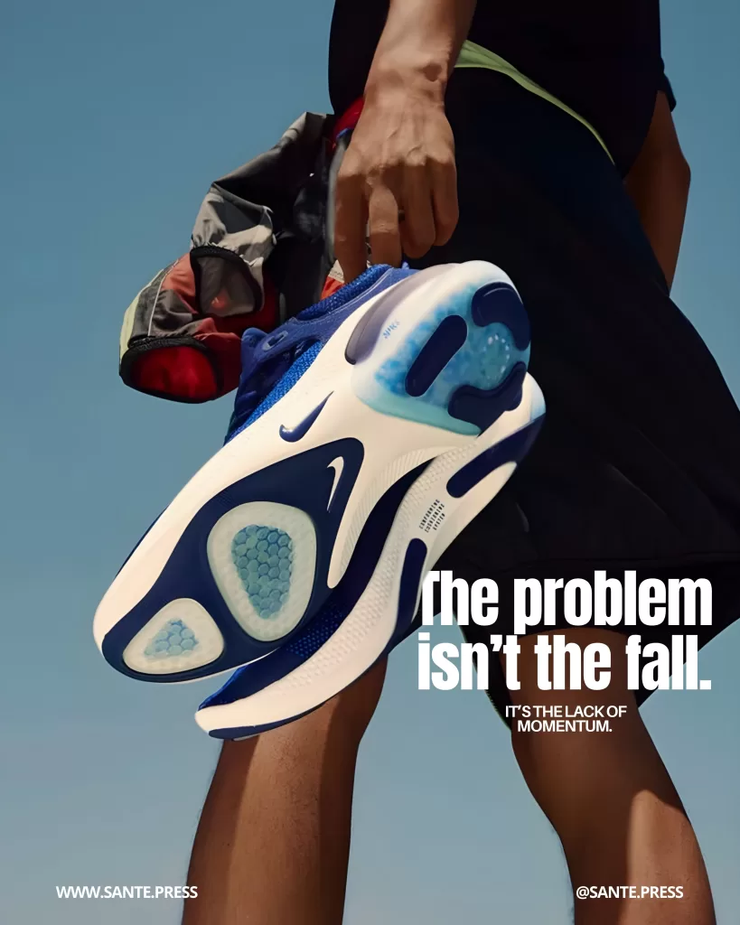 Person holding high-performance Nike running shoes with the sole visible, in an outdoor athletic setting. Text: “The problem isn’t the fall. It’s the lack of momentum.”