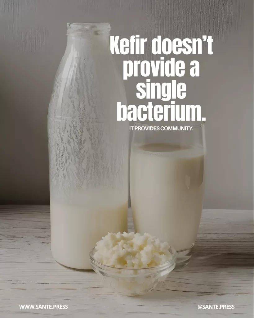 Bottle and glass of kefir next to a small bowl with kefir grains. Text: “Kefir doesn’t provide a single bacterium. It provides community.”