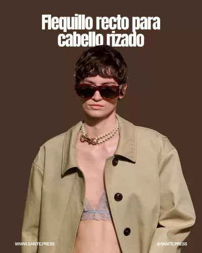 Corte de cabello rizado con flequillo recto, una tendencia chic que añade estructura y sofisticación al rostro.