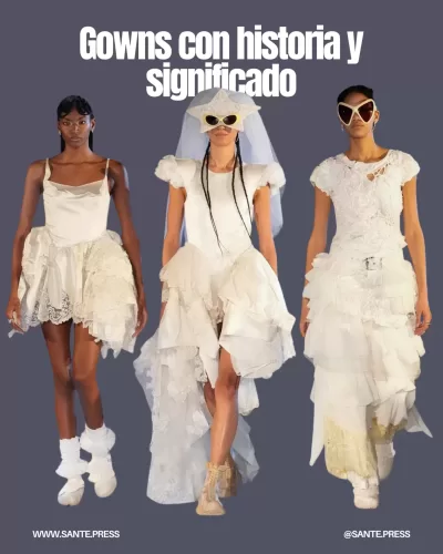 Vestidos de novia y primera comunión antiguos en el desfile, simbolizando amor propio e independencia, cerrando con un beso.