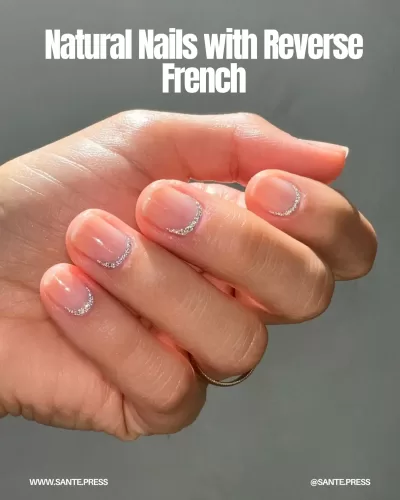 Modern inverse French manicure with silver or gold lines near cuticles, offering a minimalist yet sophisticated look.