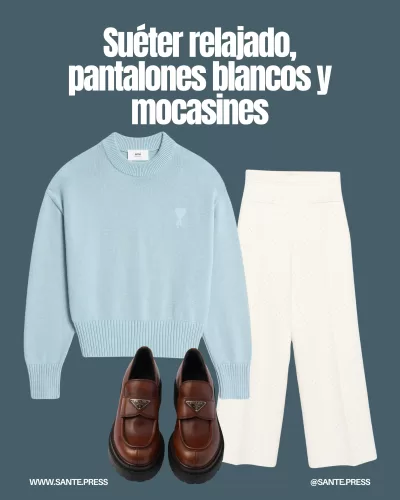 Suéter de corte relajado con escote pronunciado, combinado con pantalones blancos y mocasines clásicos para un look elegante.