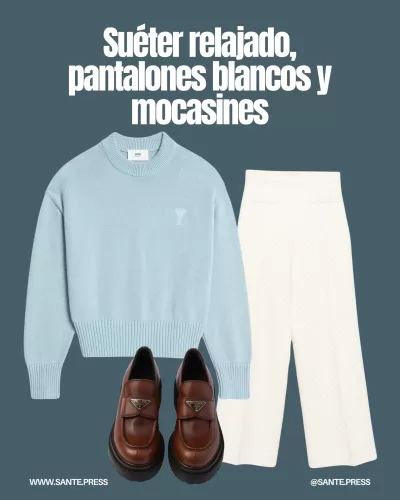 Suéter de corte relajado con escote pronunciado, combinado con pantalones blancos y mocasines clásicos para un look elegante.
